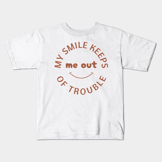My Smile Keeps Me Out of Trouble Kids T-Shirt by Goodprints